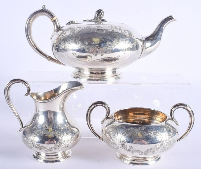 A VICTORIAN STYLE THREE PIECE SILVER TEASET. Sheffield