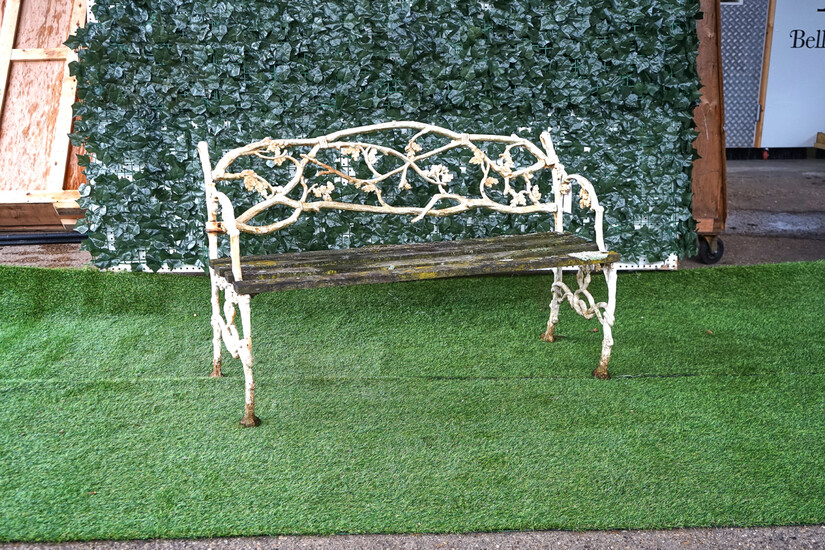 A VICTORIAN WHITE PAINTED CAST IRON GARDEN BENCH