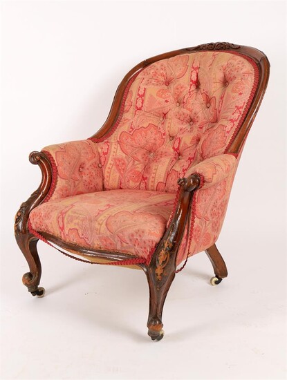 A Victorian carved walnut framed armchair