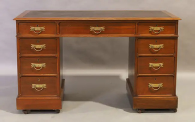 A Victorian mahogany pedestal desk, last quarter 19th century, leather writing surface...
