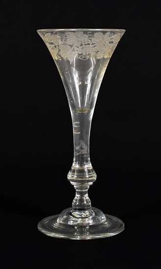 A Wine Glass, 1740, the drawn trumpet bowl engraved with...