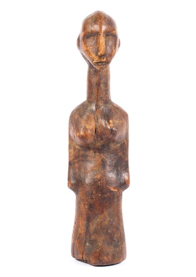 A carved wooden tribal figure of a woman