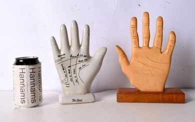 A ceramic palmistry hand together with a wooden hand 24 cm. (2).