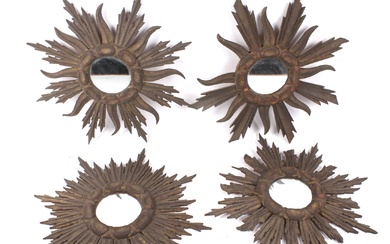 A collection of four similar carved gilt wood 'sunburst' wall mirrors.