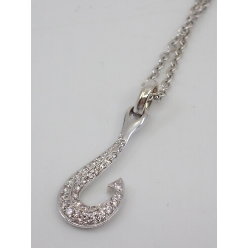 A diamond set pendant on an 18ct gold chain, total estimated...