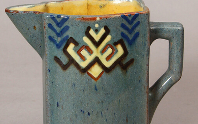 A faience pitcher Beginning of 20th century. Author's initials A.S (A.Sirotin). Faience, painting. Height 14 cm. There is a gap.