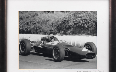 A framed photograph of Peter Arundell driving the Lotus F2...