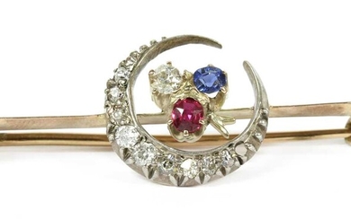 A gold and silver, diamond, ruby and sapphire crescent bar brooch