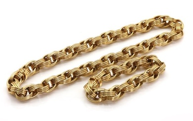 A gold oval link necklace and bracelet suite, by Tiffany & Co.