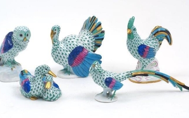 A group of five Herend porcelain animals, late 20th / 21st century, hand painted in the green fish scale design with gilt accents, to include: a turkey standing upright, 12cm high, a rooster with head turned to the right, 14cm high, an owl with...