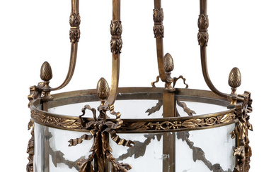 A large French Louis XVI style bronze and glass...