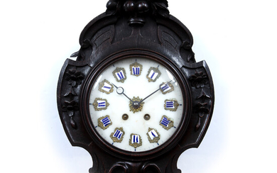 A late 19th century French oak wall clock