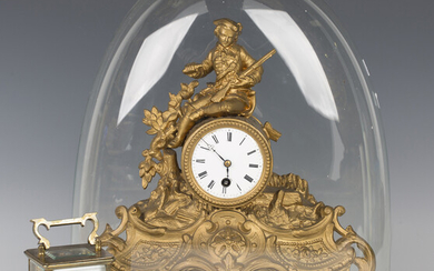 A late 19th century gilt spelter mantel timepiece with eight day movement, the circular enamel dial