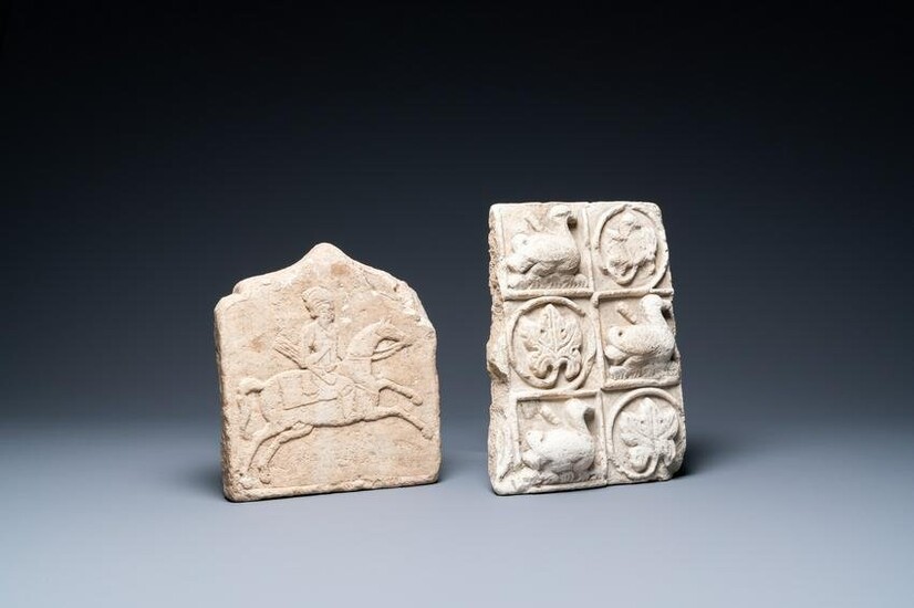 A marble 'horserider' tile fragment and a sandstone fragment with birds and floral vines, Persia