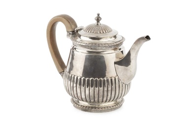 A mid Victorian silver bachelor's teapot, with gadrooned borders and...