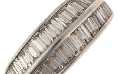 A modern 18ct white gold diamond band ring, ridge set with b...