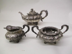 A near three piece George IV Irish silver tea set by Smith &...