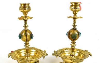A pair of Aesthetic Movement brass and glass candlesticks,...