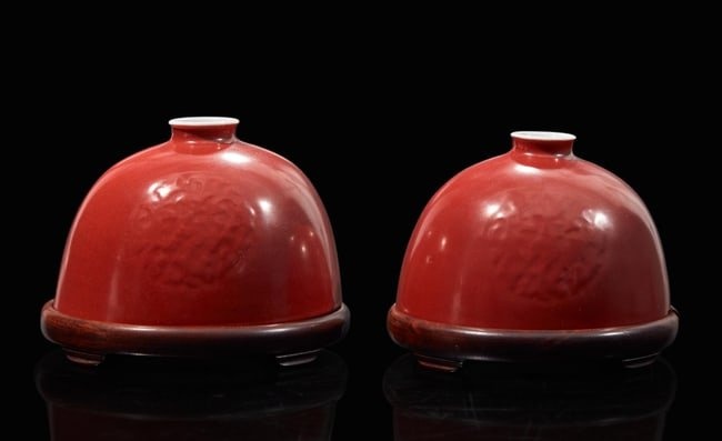 A pair of Chinese iron-red enameled water coupes with hardwood bases 礬紅太&#30333