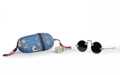 A pair of Chinese quartz sunglasses with silk case and a jade...