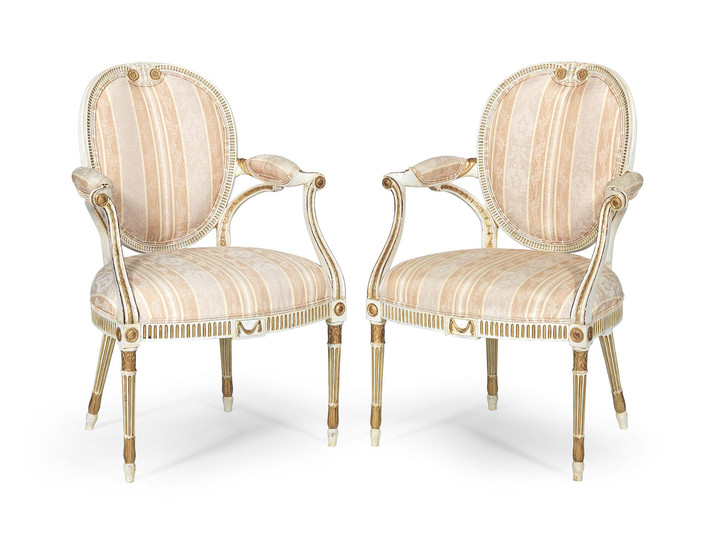 A pair of George III painted and parcel gilt armchairs