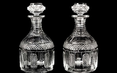 A pair of Georgian design cut glass decanters and stoppers.