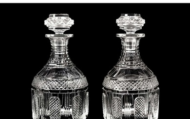 A pair of Georgian design cut glass decanters and stoppers. ...