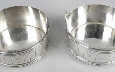 A pair of William IV Irish silver coasters of twin-handled barrel form.