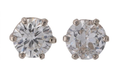 A pair of diamond earstuds, each claw set with a brilliant-cut diamond, each weighing approximately 0.50 carats, screw post fittings