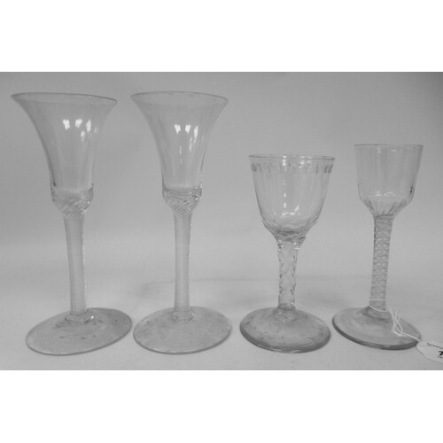 A pair of mid 18thC wine glasses with plain bell shaped bowl...
