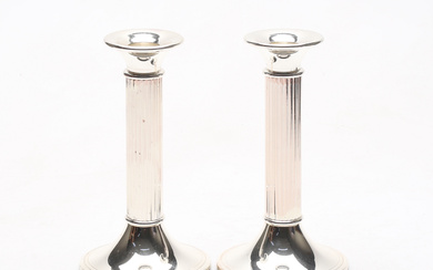 A pair of white metal candlesticks, Gold Finds.
