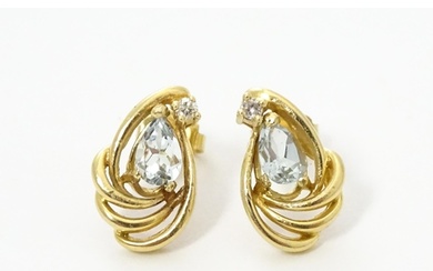 A pair of yellow metal earrings set with diamond and aquamar...