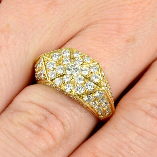 A pave-set diamond geometric dress ring. Total diamond