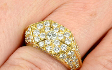 A pave-set diamond geometric dress ring.