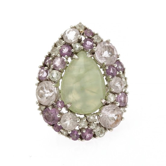 A prehnite and diamond ring set with a pear shaped prehnite encircled by numerous oval-cut amethysts and brilliant-cut diamonds.