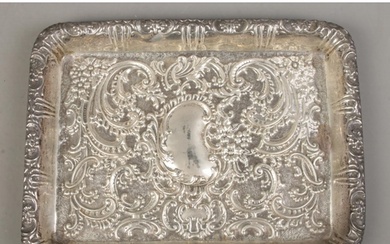 A rectangular silver tray, with repousse decoration and blan...