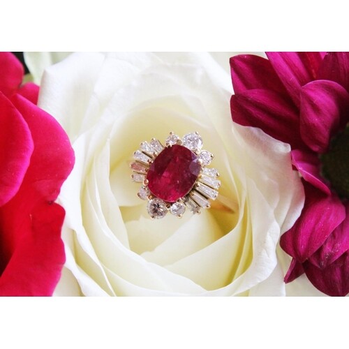 A ruby and diamond cluster ring, the central rectangular cus...