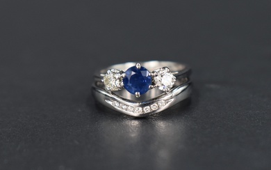 A sapphire and diamond trilogy ring, the central round cut sapphire approx. 0.33cts flanked by two