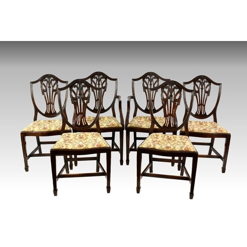A set of six mahogany shield back dining chairs in the Georg...