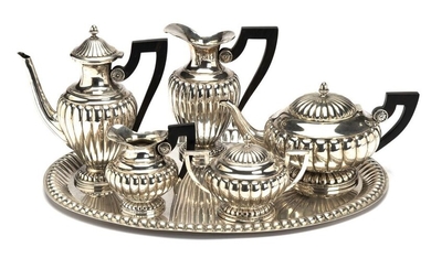 A silver five piece tea service and tray