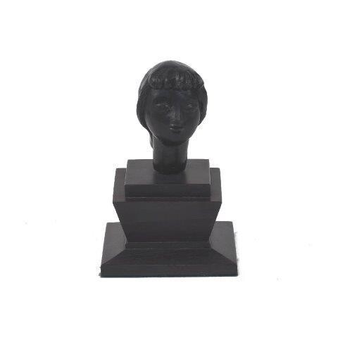 A small composite bust of a woman with hair pulled back into a low chignon, on stepped hardwood base, indistinct inscribed monogram to reverse, 7.5cm high excl. base