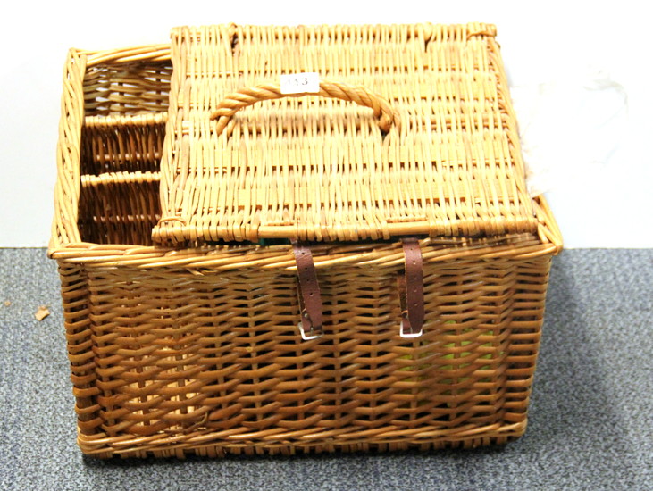A vintage French picnic basket and picnic set.