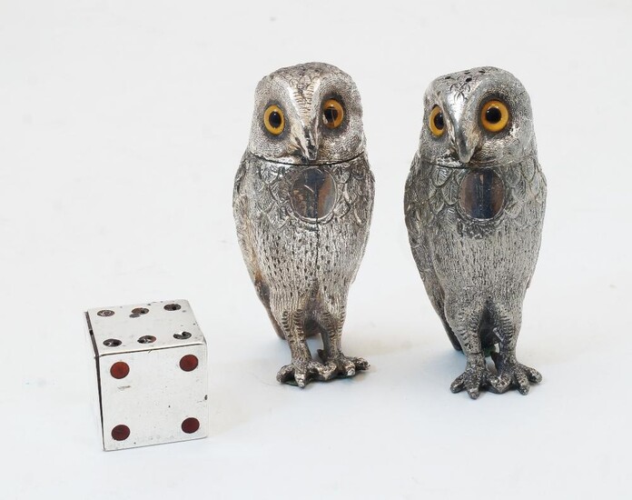 AMENDMENT: The description should read - A Victorian novelty silver and enamelled pepper shaker in the form of a die and the revised estimate is £200-300A Victorian silver trinket box in the form of a dice, London, 1889, Thomas Johnson II, with red...