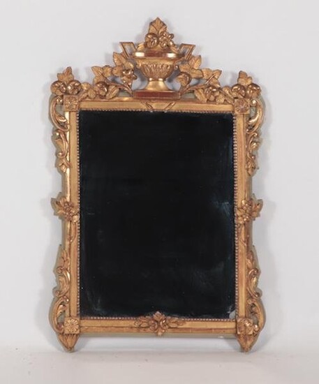 AN 18TH CENTURY CARVED AND GILT FRENCH MIRROR