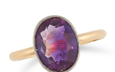 AN AMETHYST RING set with an oval cut amethyst to a