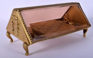 AN EARLY 20TH CENTURY FRENCH GILT METAL TRIANGULAR FORM