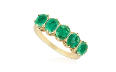 AN EMERALD FIVE-STONE RING Set with a graduated row of...
