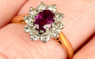 An 18ct gold ruby and brilliant-cut diamond cluster ring.