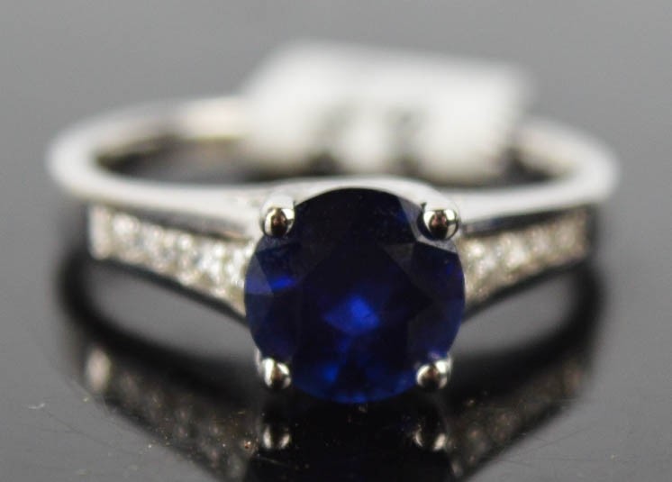 An 18ct white gold, blue sapphire and diamond ring, 1.8ct sa...