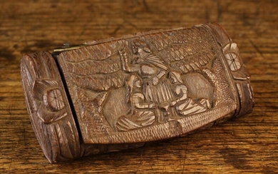 An 18th Century Carved Treen Snuff Box of Rectangular cushion form. The hinged lid relief carved wit